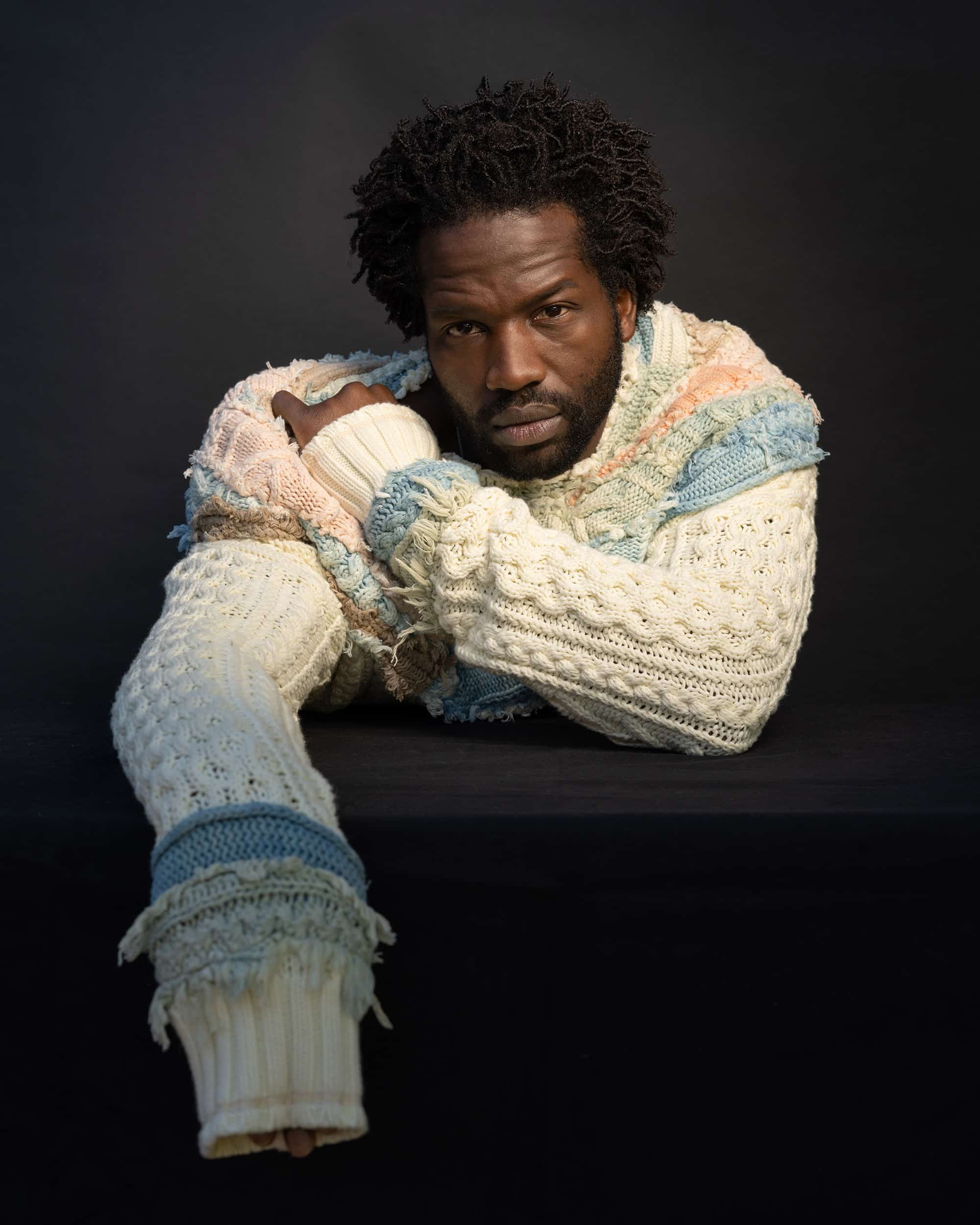 Sopẹ́ wears pastel cable knit sweater. By GREG LAUREN. // : Dylan Coulter