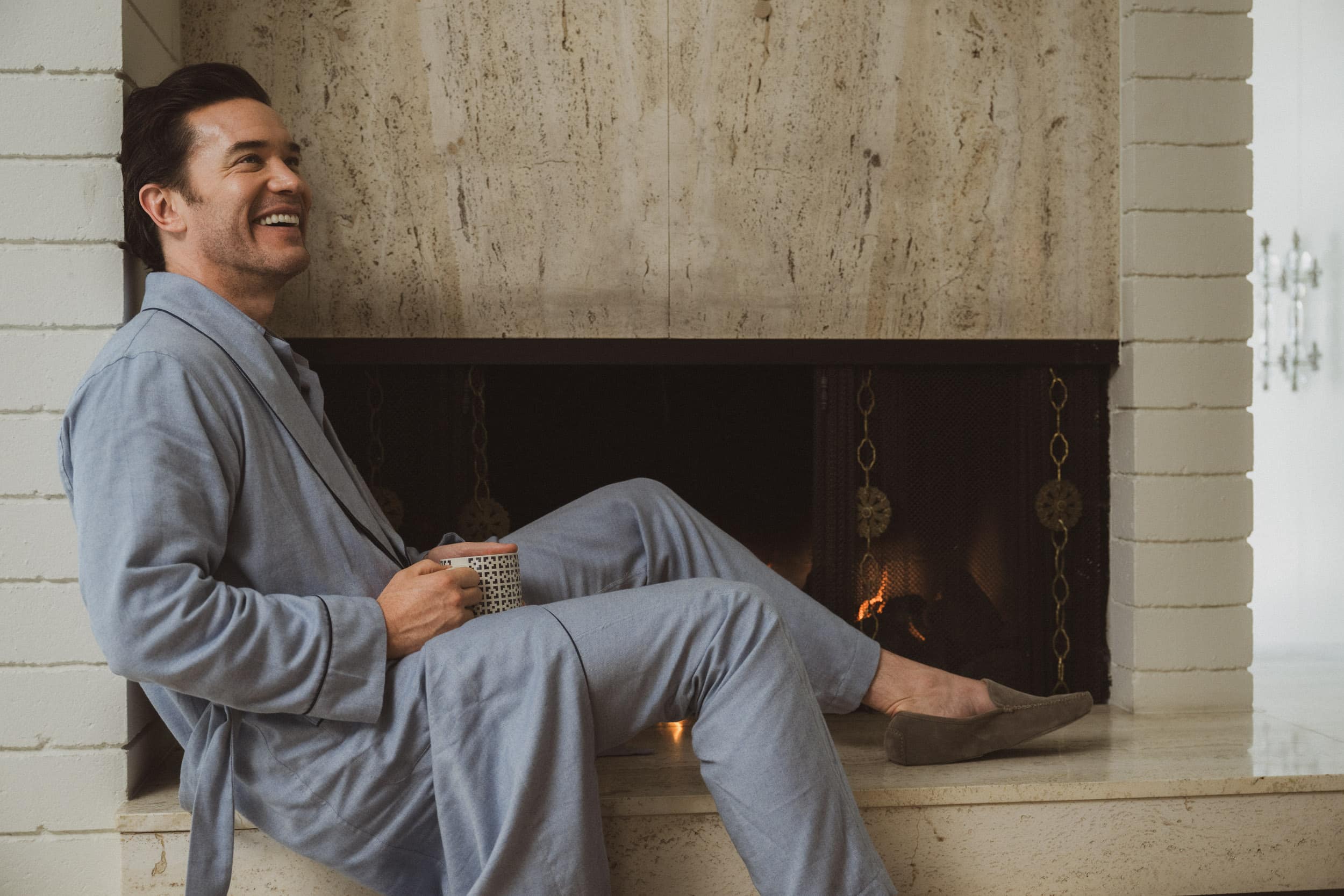 Tom wears blue cotton dressing gown, blue cotton pajamas, taupe suede slippers, all by THOM SWEENEY // 📸 : Dylan Coulter