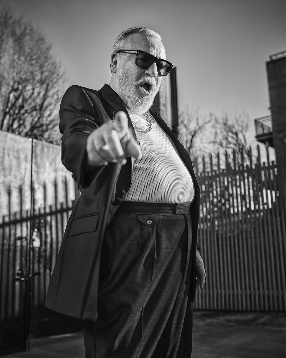 Ray wears Tux by Connoly, Vest by Marks and Spencer, Chain by Goosens, Glasses by Jaques Marie Mage // 📸 : Gavin Bond